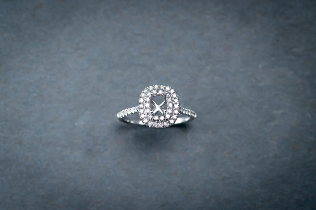 18K white gold engagement ring containing 50 round, brilliant cut diamonds 