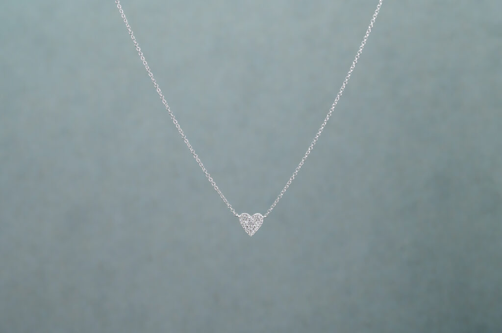 A Silver necklace with a heart-shaped pendant