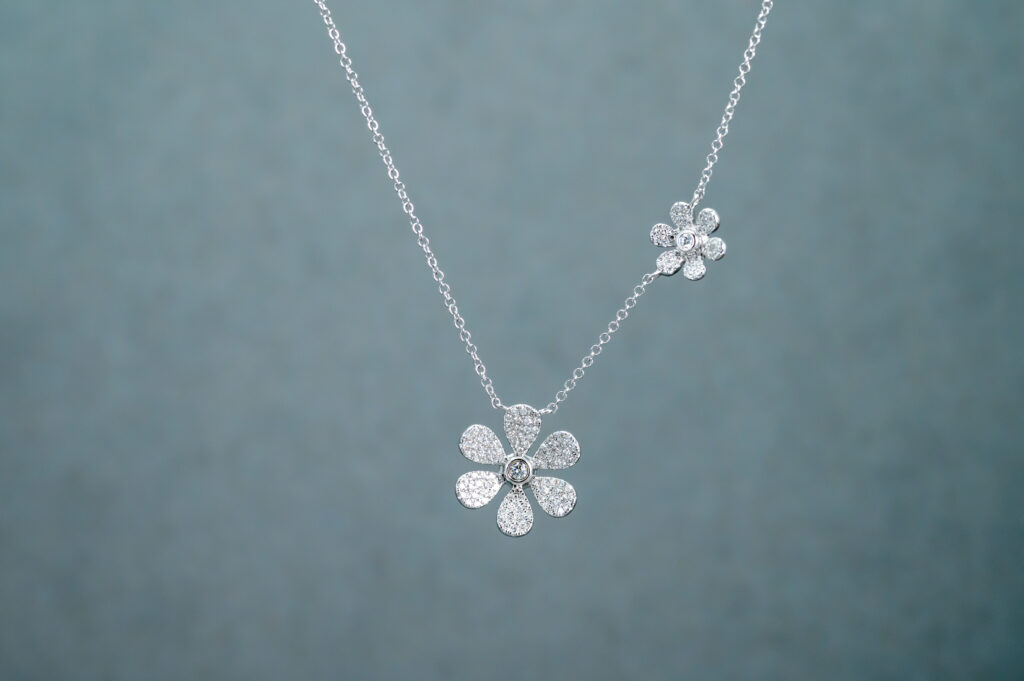 Necklace with two flower-shaped pendants