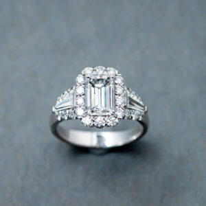 18k white gold engagement ring with one emerald cut diamond  
