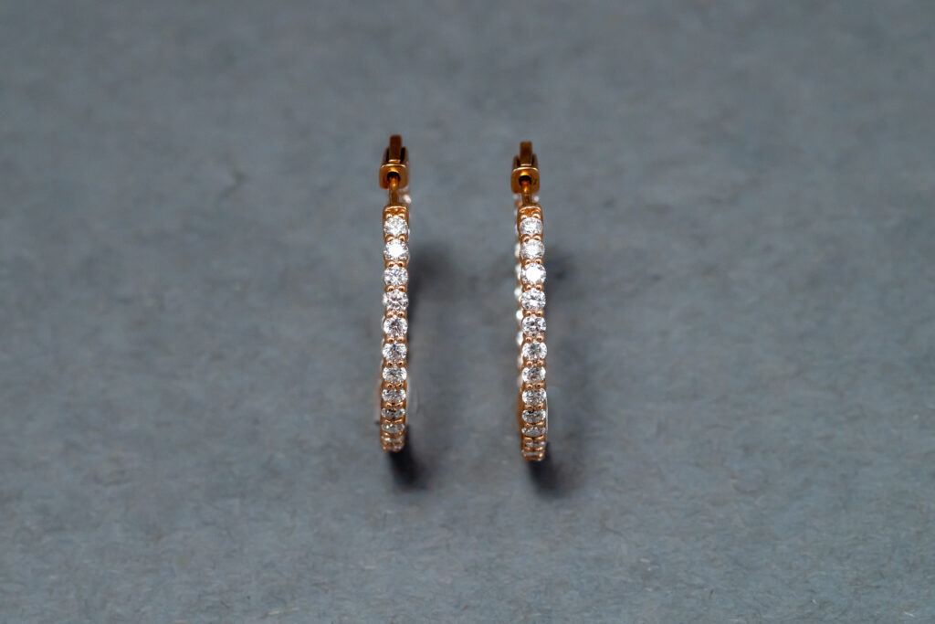 A 14k Rose Gold Diamond hoop earrings  