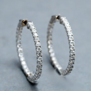 A 14k White Gold Diamond hoop earrings  