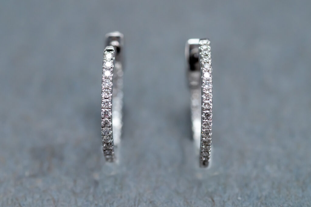 A 14k White Gold Diamond Huggie earrings 