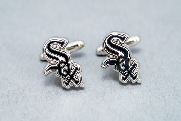 A pair of chicago white sox cufflinks.