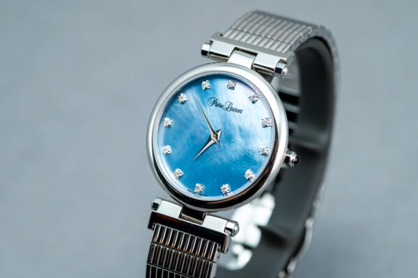 A blue watch with diamonds on the face.