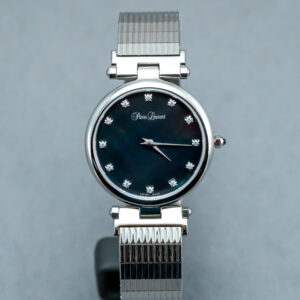 A watch is shown with the strap removed.
