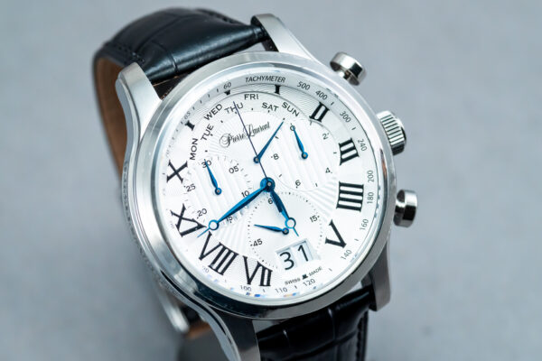 A watch with roman numerals and blue hands.