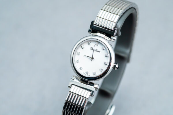 A silver watch with a white face and black hands.