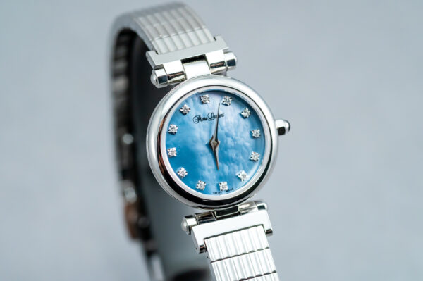 A blue watch with diamonds on the face.