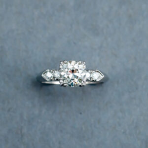 A diamond ring with six small diamonds on it.