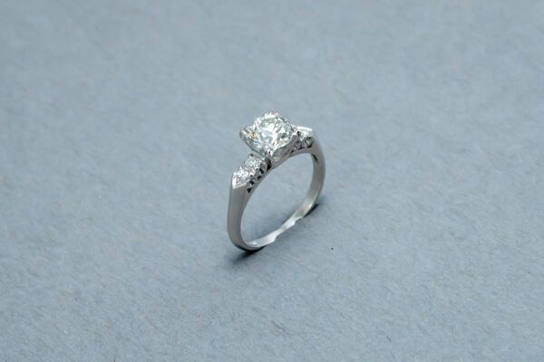 A diamond ring is shown on the ground.