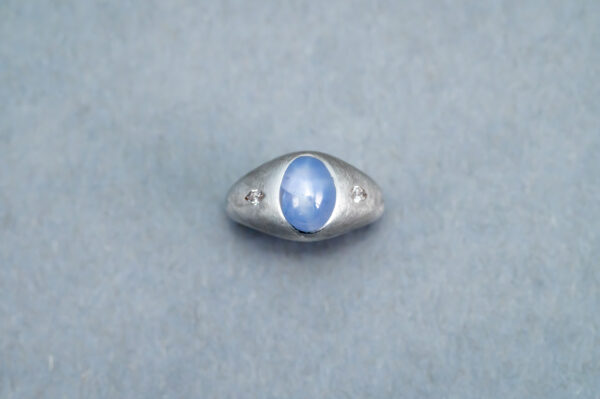 Silver ring with white gold star sapphire and diamond 
