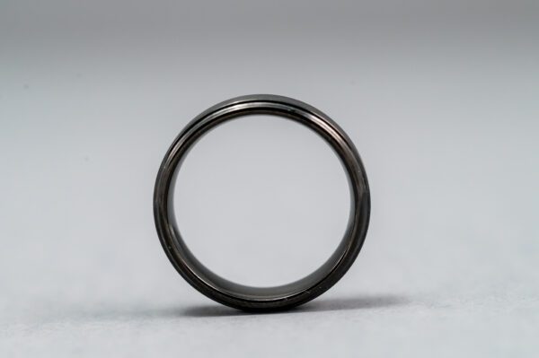 A black ring is shown on the ground.