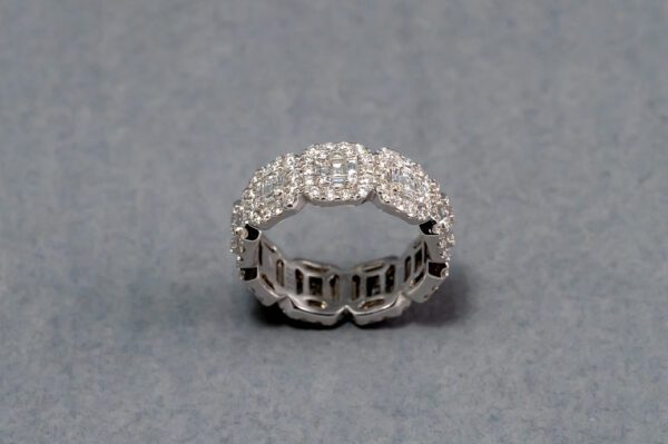 A silver ring with some diamonds on it