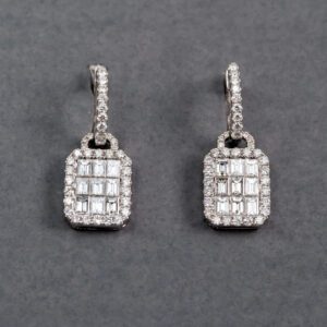 A pair of diamond earrings with square cut diamonds.
