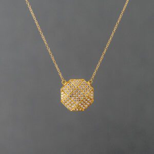 A gold necklace with a diamond in the middle of it.