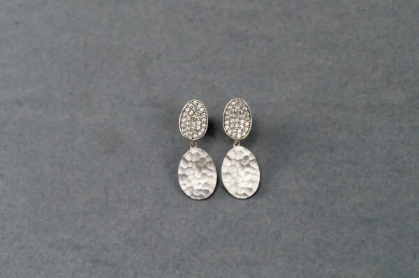 A pair of silver earrings with a diamond design.