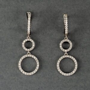 A pair of diamond earrings with two circles hanging from them.