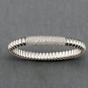 A silver bracelet with some white stones on it