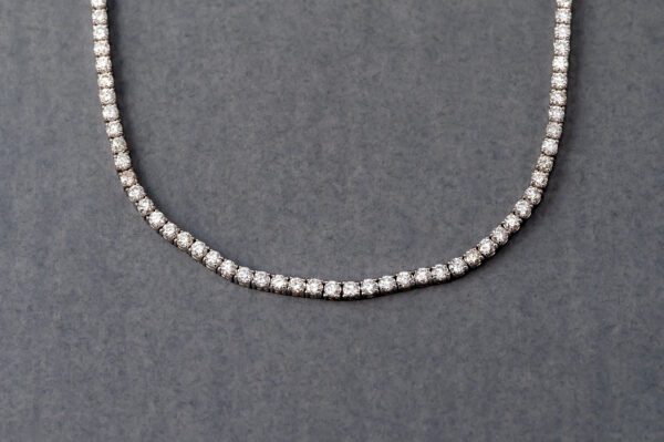 A necklace with pearls on it is shown.