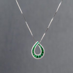 A necklace with green stones on it