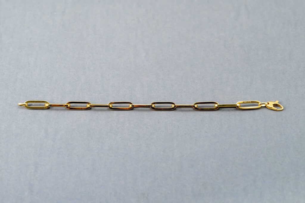 A chain of gold colored links is shown.