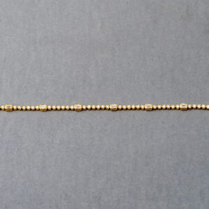 A close up of the bottom of a necklace