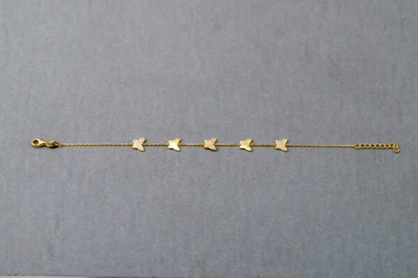 A row of small gold stars on a gray background.