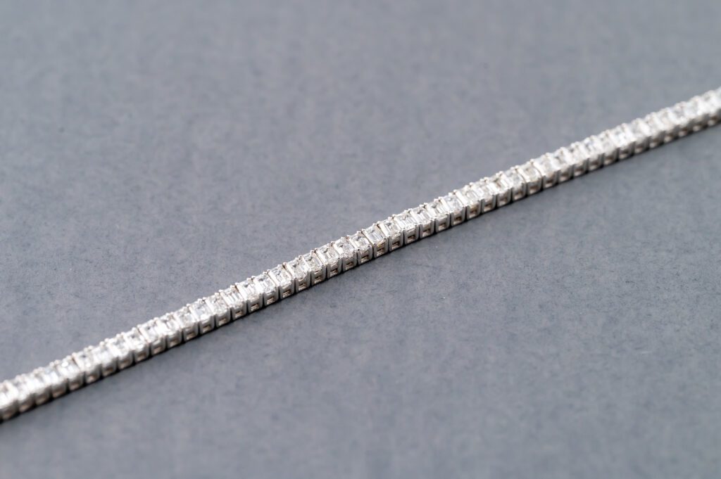 A close up of the side of a silver bracelet
