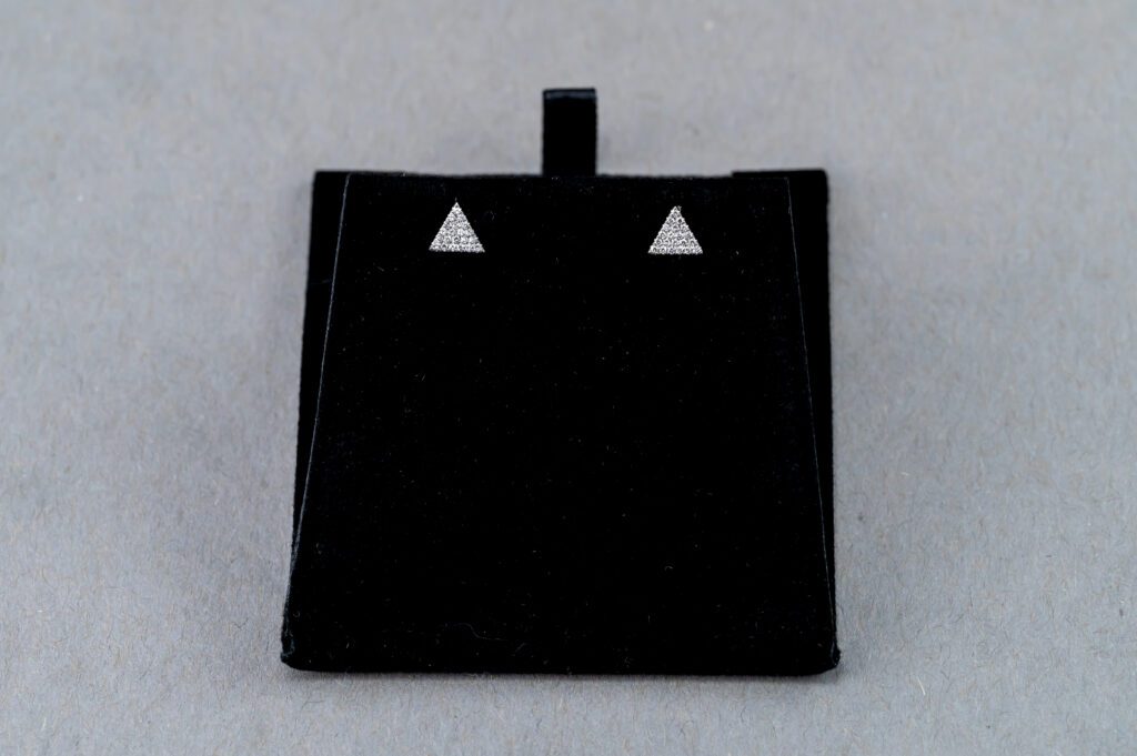 A black square shaped object with two triangles on it.