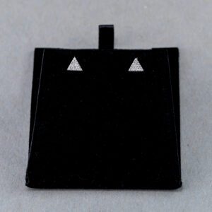 A black square shaped object with two triangles on it.
