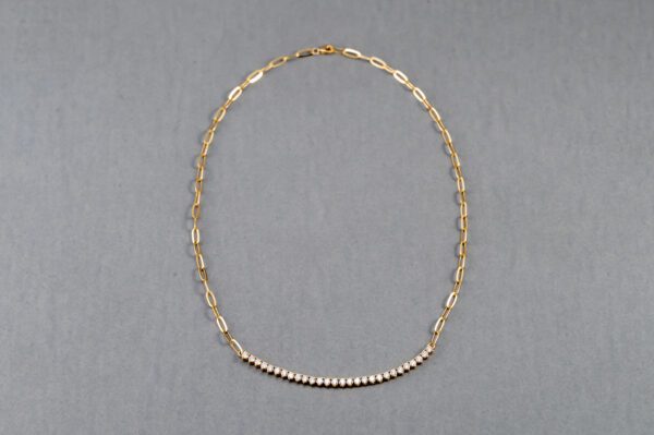 A necklace with a row of pearls on it.