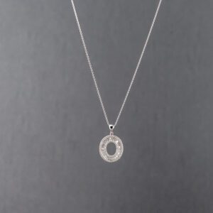 A silver necklace with an open circle on it.