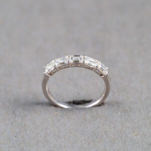 A silver ring with some kind of diamond on it